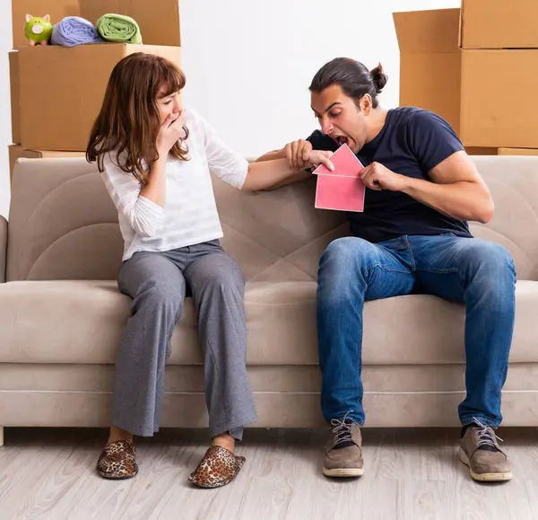 Young pair and many boxes in the divorce settlement concept