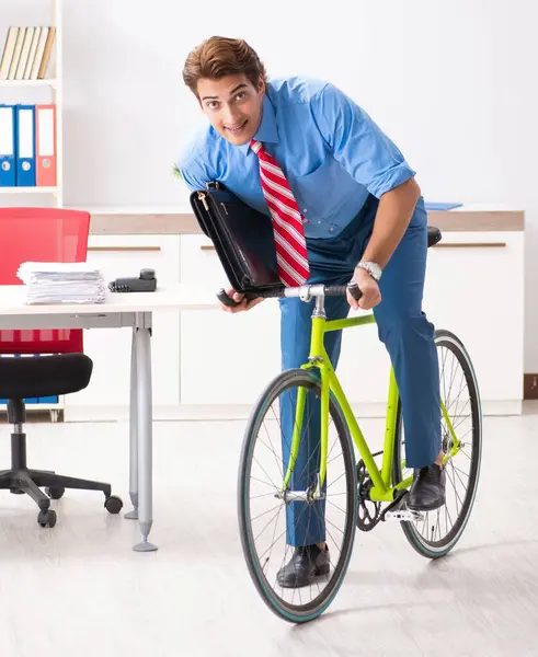 The young businessman using bike to commute to the office