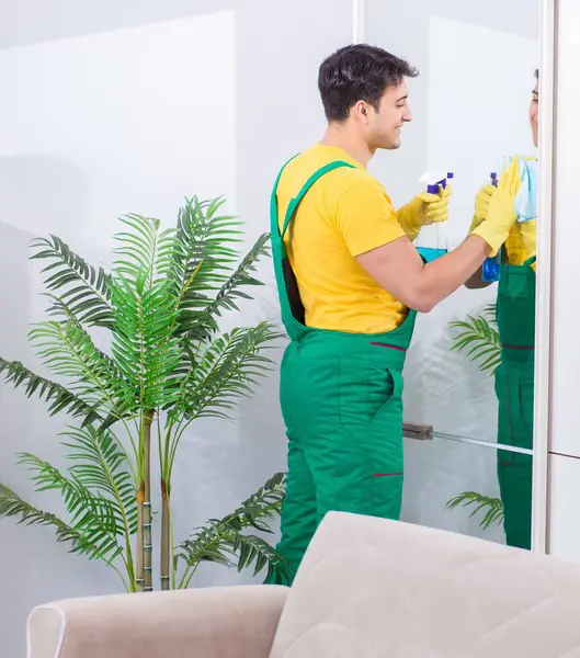 The professional cleaning contractor working at home