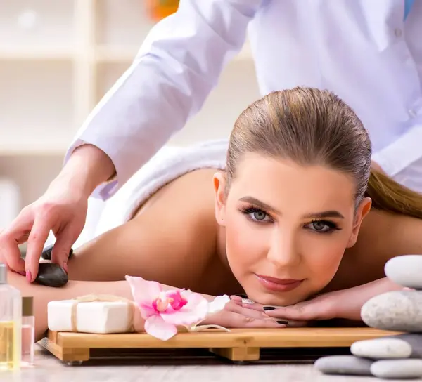 The young woman during spa procedure in salon