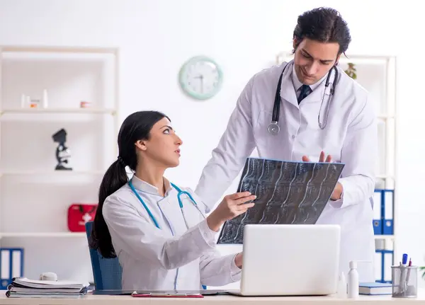 Two Young Doctors Working Clinic — Stock Photo, Image