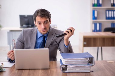 Young businessman employee talking by phone