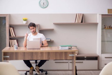 Young employee working from home during pandemic