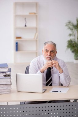 Old employee unhappy with excessive work at workplace