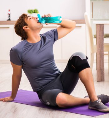 The man exercising for knee injury recovery