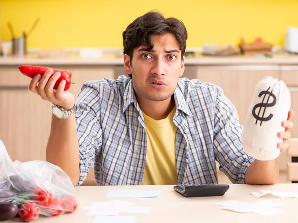 Young Man Calculating Expences Vegetables Kitchen — Stock Photo, Image