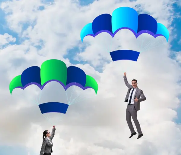 The business people falling down on parachutes