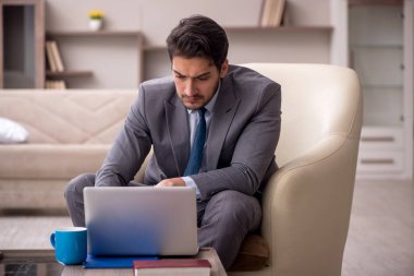 Young employee working from home during pandemic