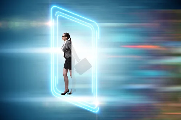 Businesswoman entering virtual world in the business concept