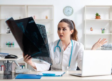 The young female doctor radiologist working in the clinic