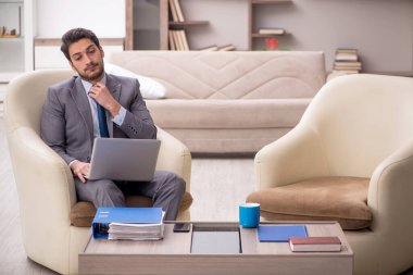 Young employee working from home during pandemic