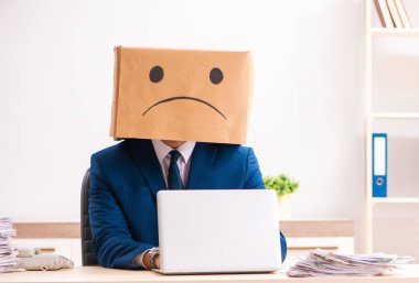 The unhappy man employee with box instead of his head clipart