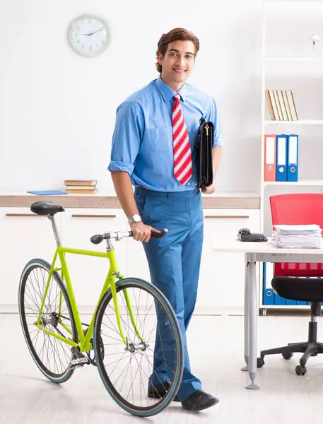 The young businessman using bike to commute to the office