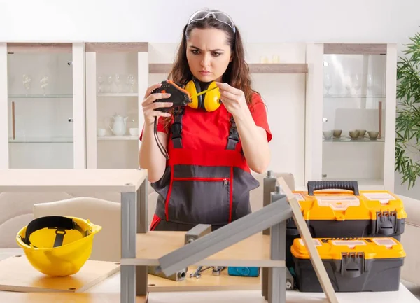 Female Contractor Repairing Furniture Home — kuvapankkivalokuva