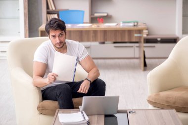 Young employee working from home during pandemic