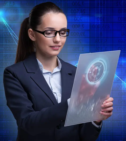 The businesswoman with tablet in business concept