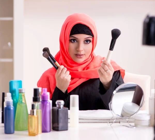 The beauty blogger in hijab recording video for her blog