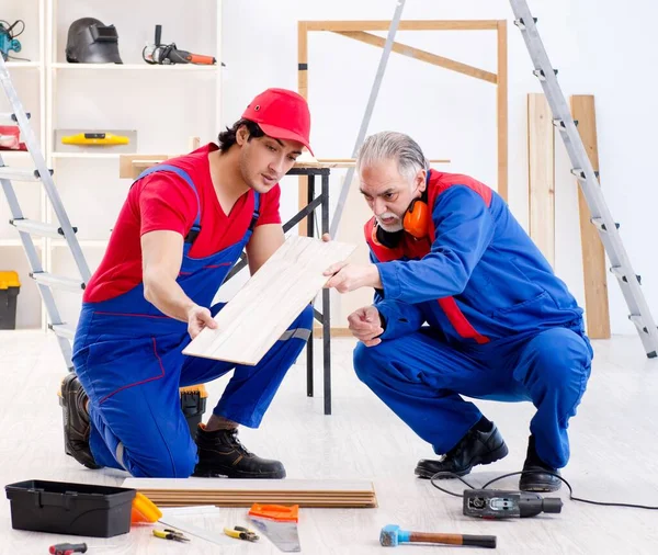 Two Professional Contractors Laying Flooring Home — Stock Photo, Image