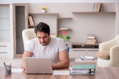 Young employee working from home during pandemic