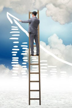 İş adamı gökyüzüne çizimler çiziyor.