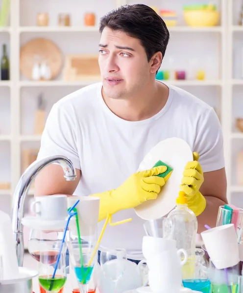 The man frustrated at having to wash dishes