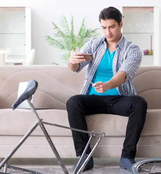 Young Man Repairing Bicycle Home — Stock Photo, Image