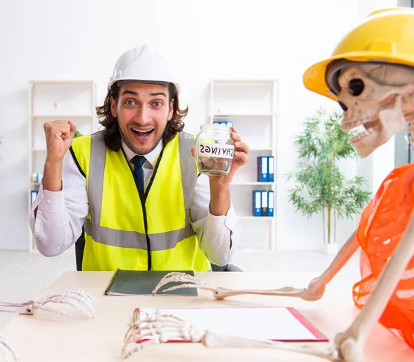Funny construction meeting with boss and skeletons
