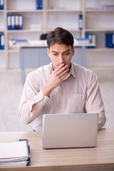 Young employee working in the office