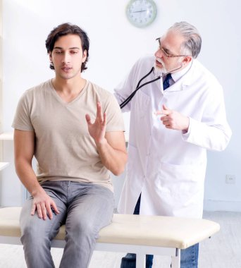 The young male patient visiting old doctor
