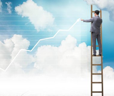 İş adamı gökyüzüne çizimler çiziyor.