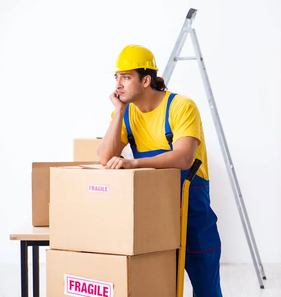 Young professional mover doing home relocation