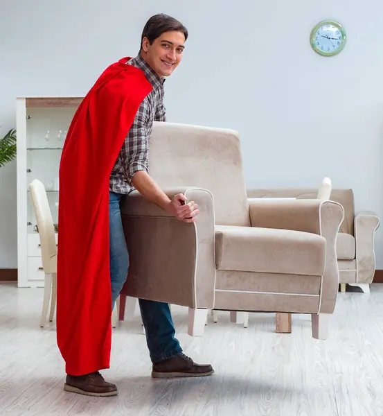 The super hero moving furniture at home