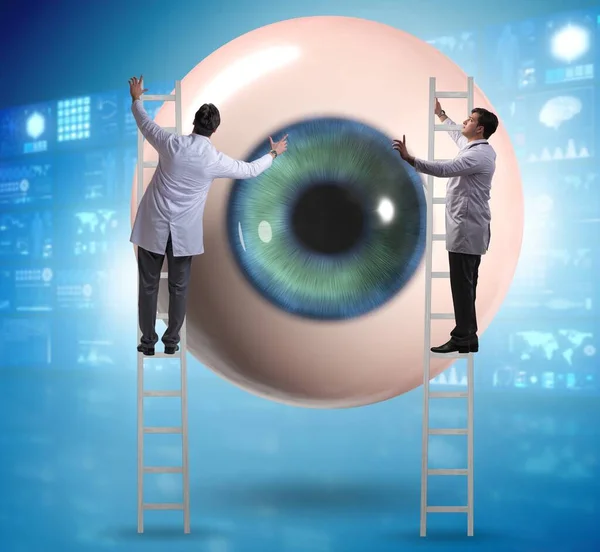 Doctor Examining Giant Eye Medical Concept — ストック写真