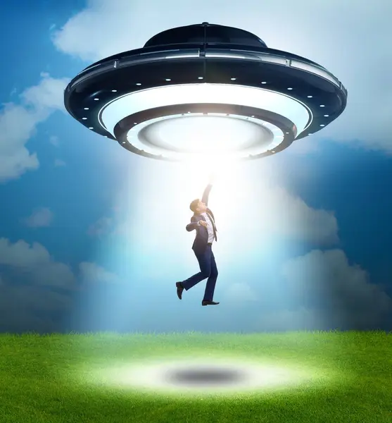 Flying Saucer Abducting Young Businessman — Stock Photo, Image