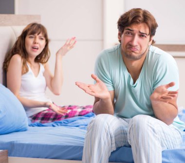 The young couple in the bedroom