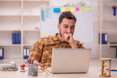 Young designer working at workplace