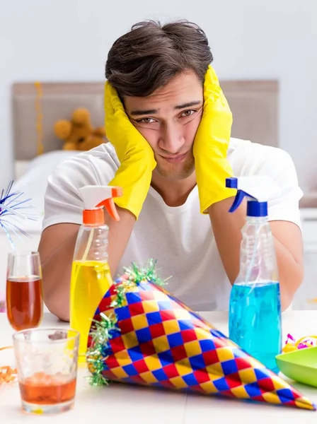 Man Cleaning House Christmas Party — Stock Photo, Image