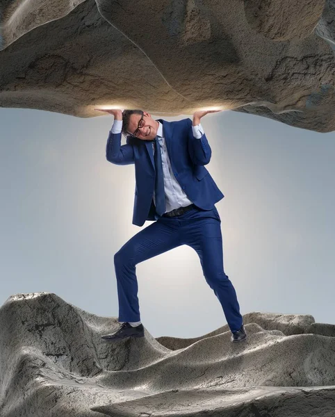 Businessman Supporting Stone Pressure — Stock Photo, Image