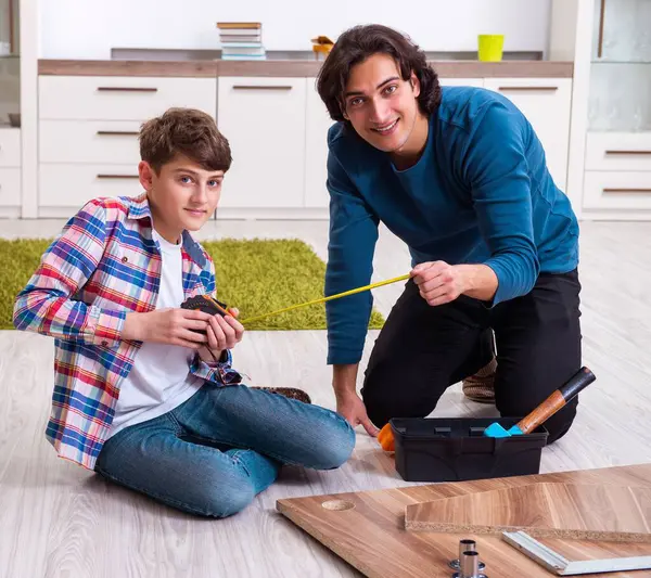 Young Carpenter Teaching His Son — Stock Photo, Image