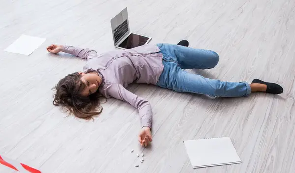 The dead woman on the floor after commiting suicide