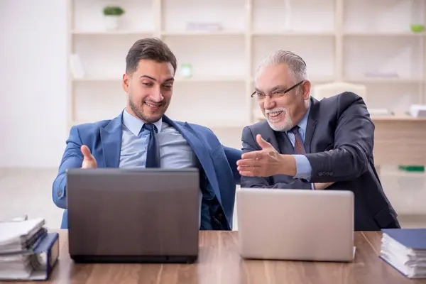 Two Employees Sitting Workplace Royalty Free Stock Images