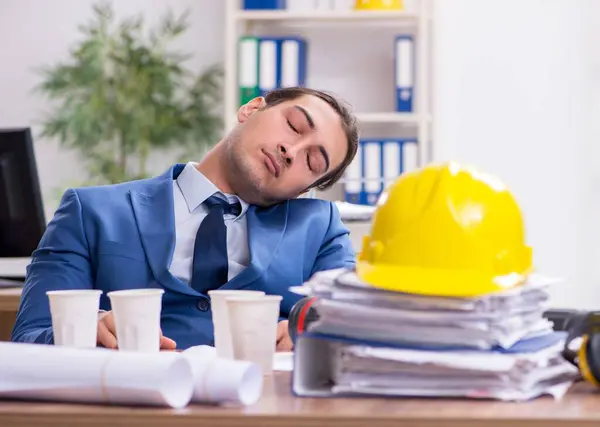 stock image Young male architect working in office