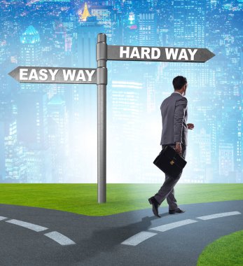 The businessman choosing between hard and easy way