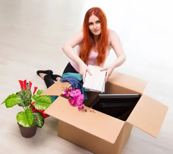 stock image The young woman moving house in lifestyle concept