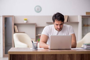 Young employee working from home during pandemic