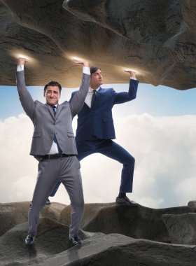 Baskı altında taşı destekleyen işadamı