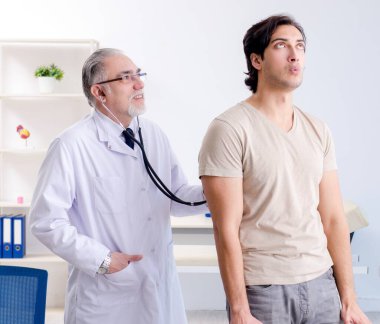 The young male patient visiting old doctor