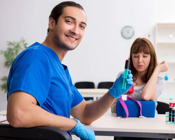 stock image Young woman in the blood transfusion concept