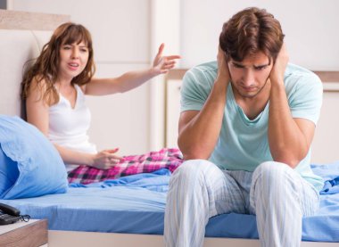 The young couple in the bedroom