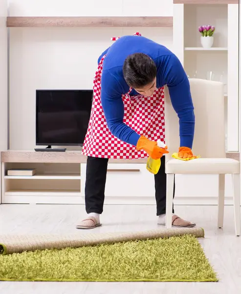 stock image The contractor man cleaning house doing chores